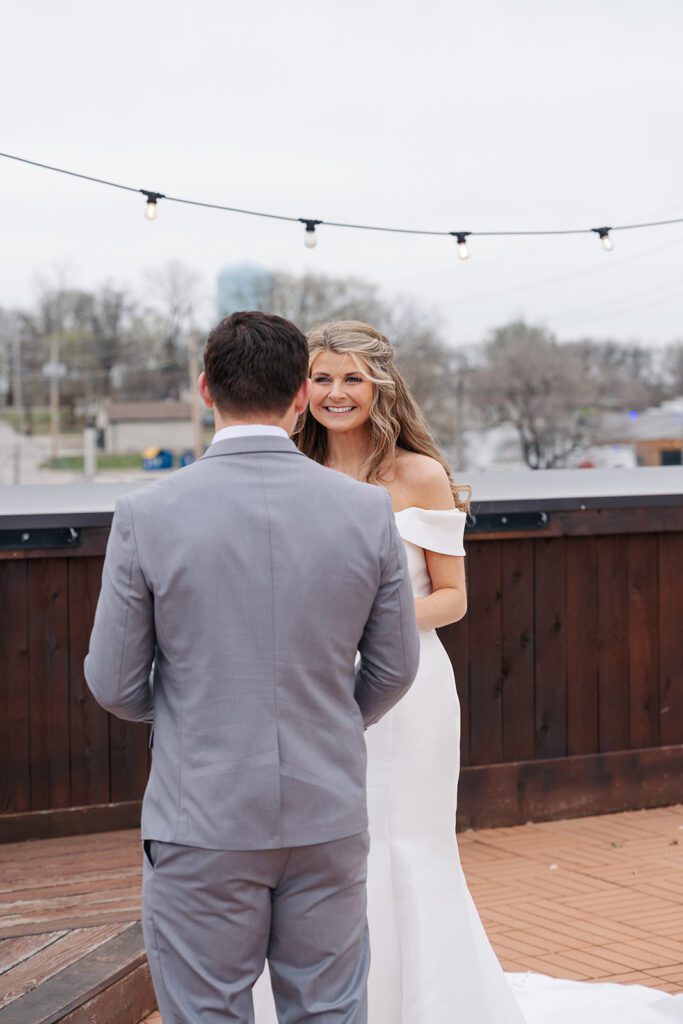 Kendal Banks Photography Kansas City Wedding couple exchanges private vows on the rooftop of The Stanley in Lee's summit. 