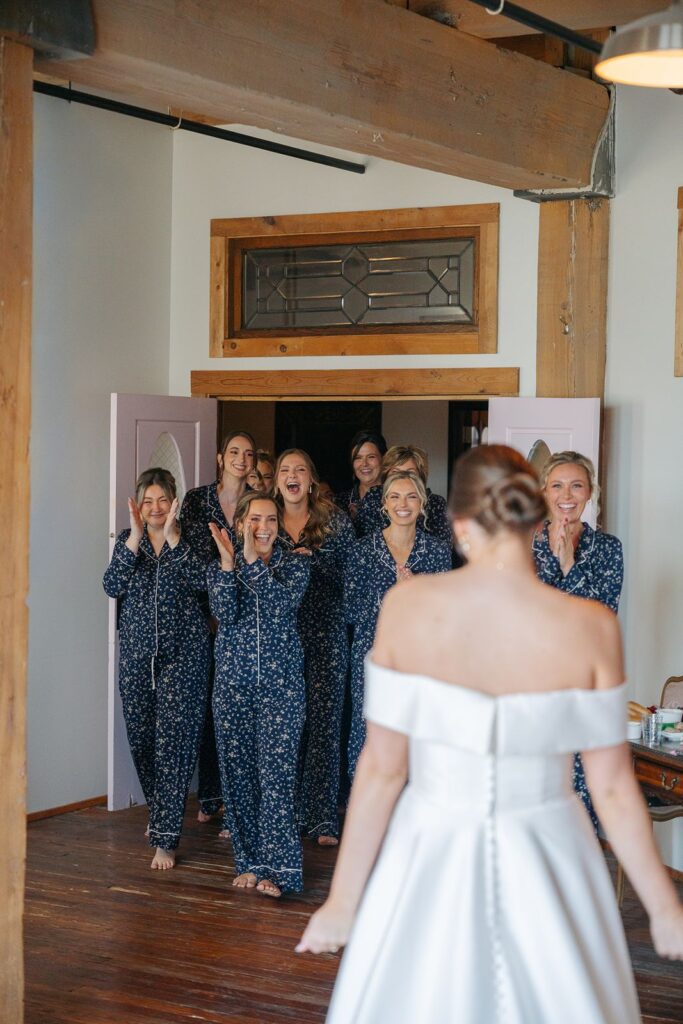 A bride does a first look with her bridesmaids at her KC wedding