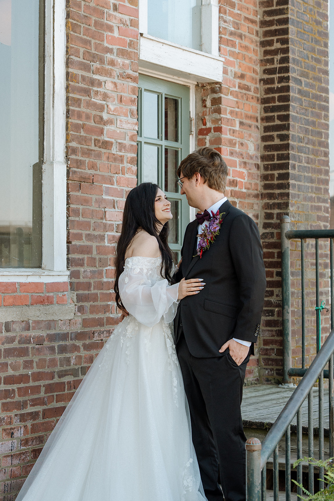 A bride and groom gaze at each other after their Abe and Jakes Landing; lawrence wedding venue
