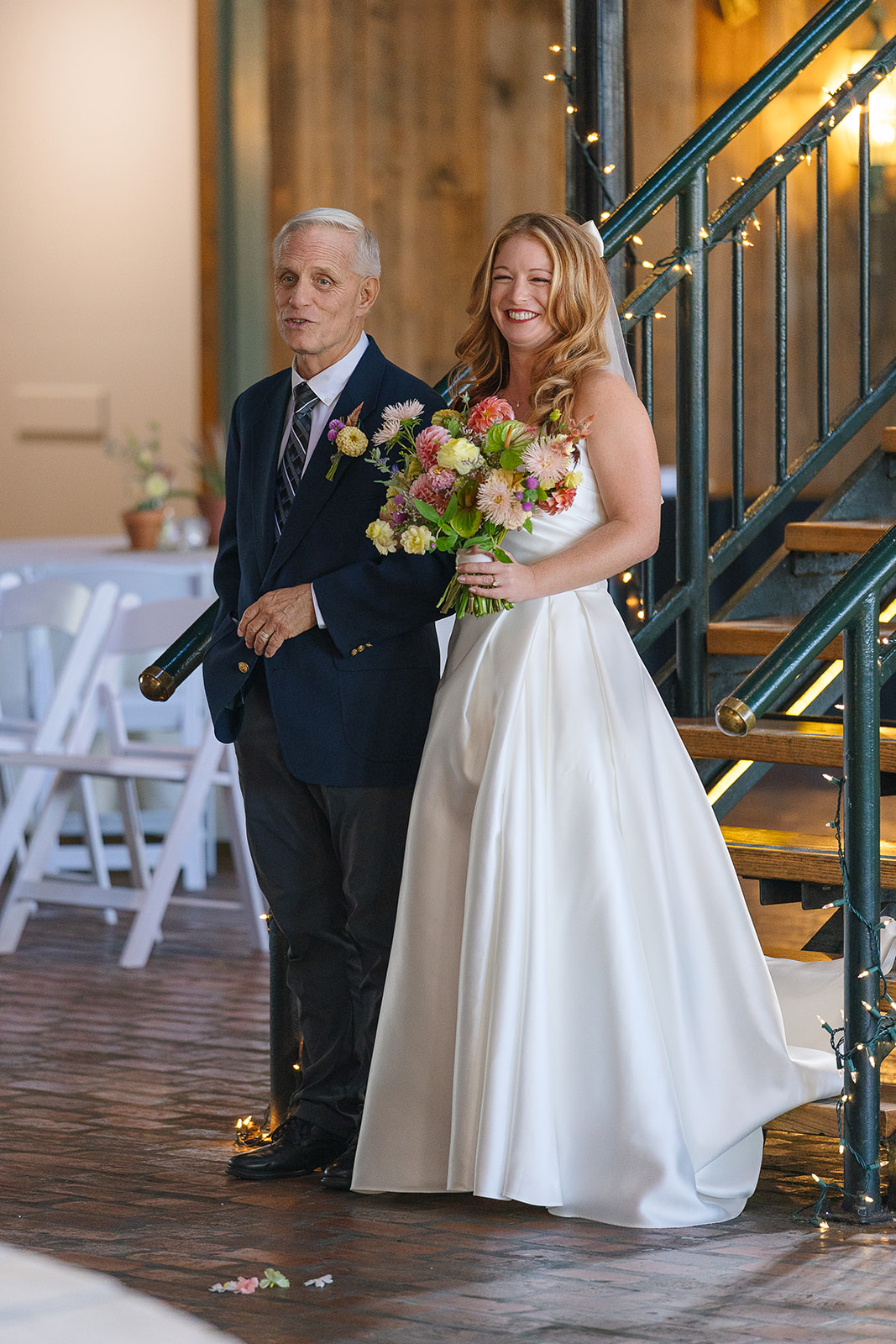 bride and father stand ready to walk down the aisle.