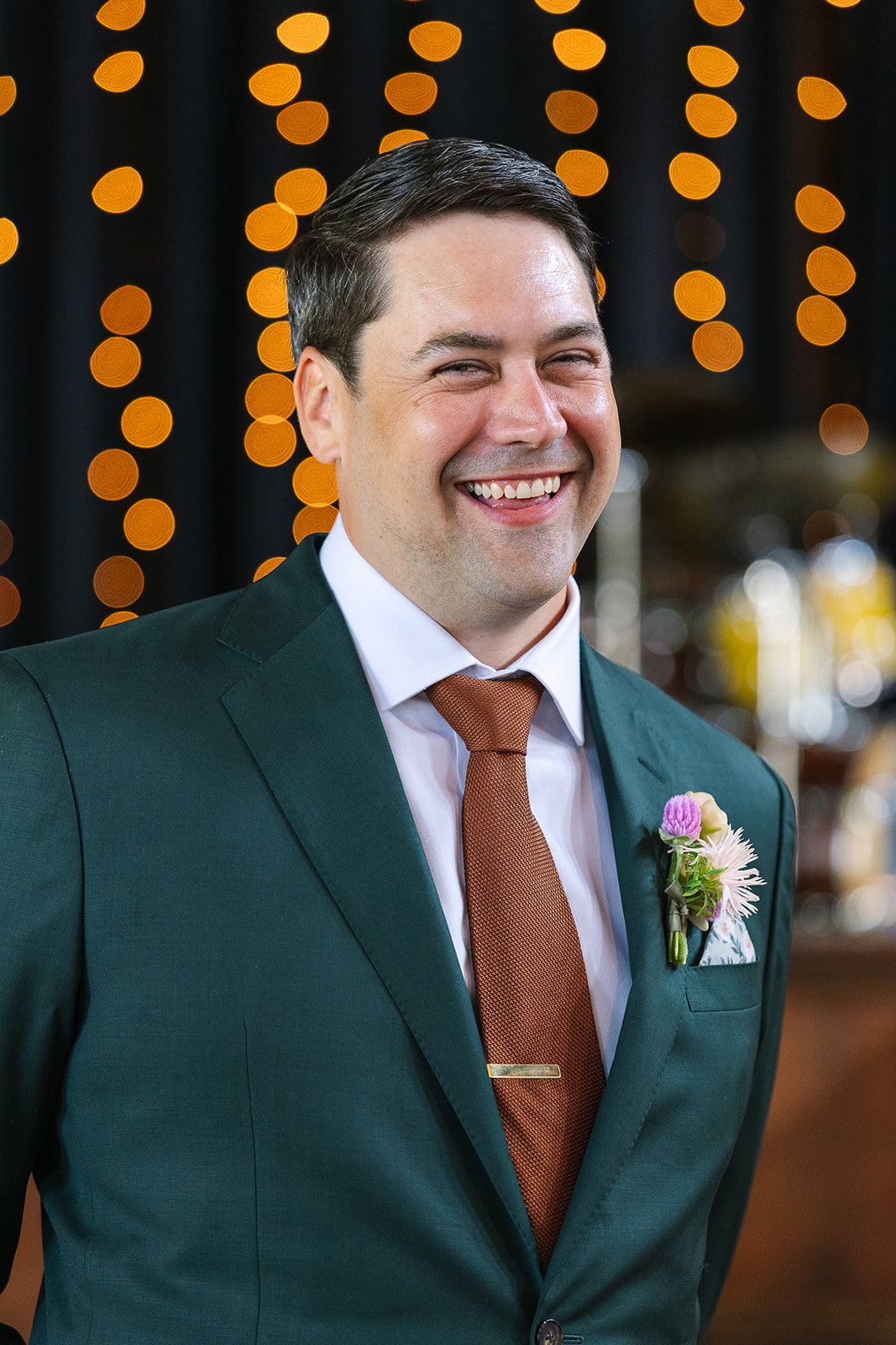 groom smiles at camera